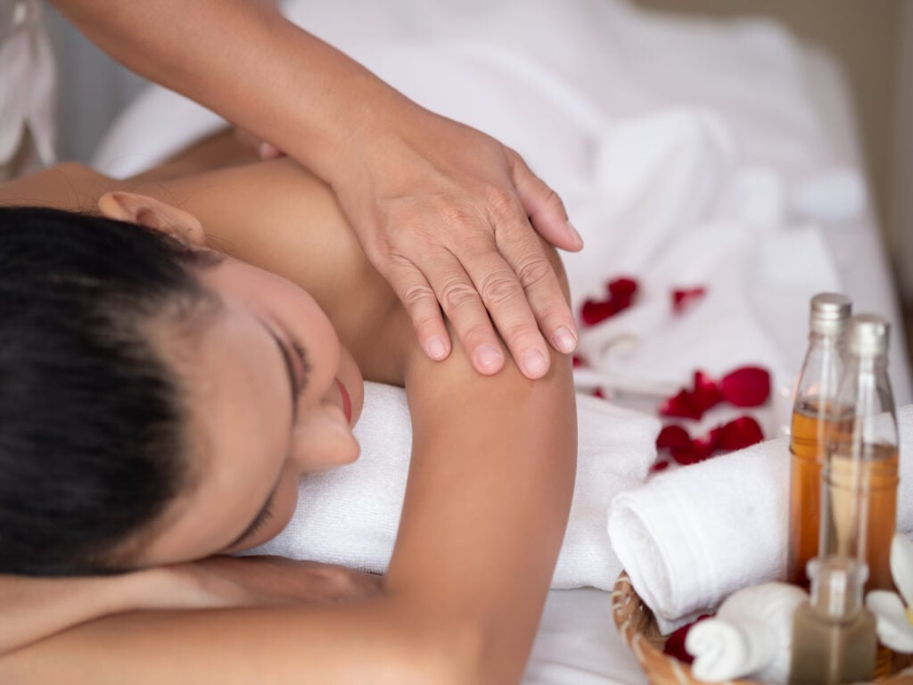 woman receiving thai massage